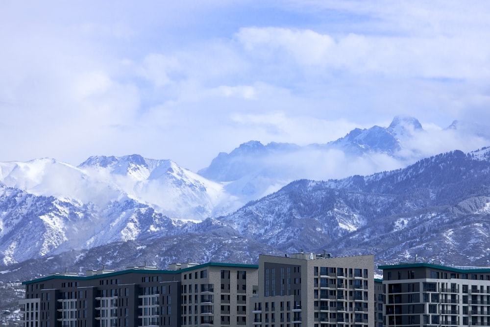 a view of a city with mountains in the background