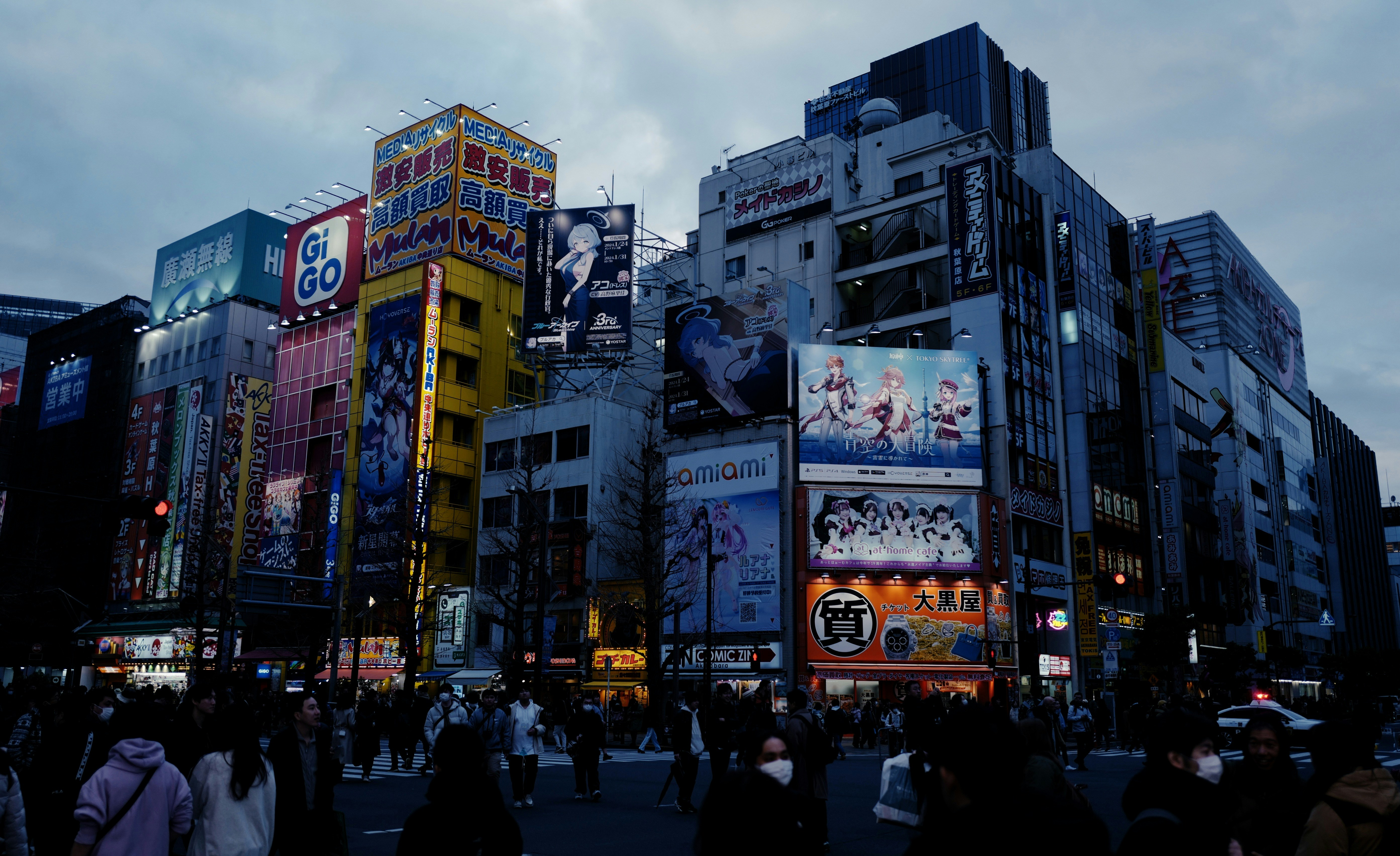 a city street filled with lots of tall buildings