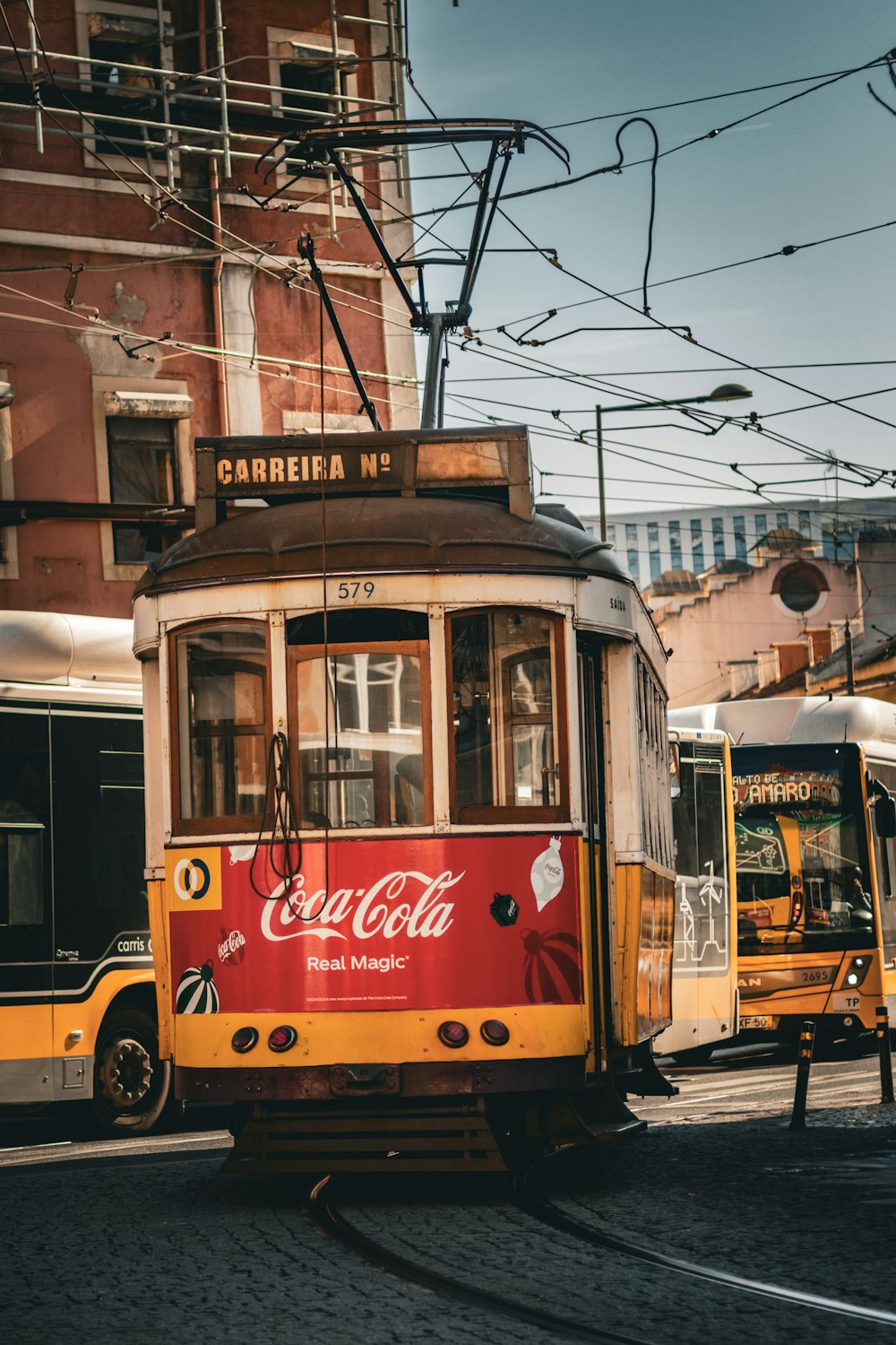 a trolley car on a street in a city