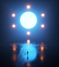 a person standing in the middle of a dark street