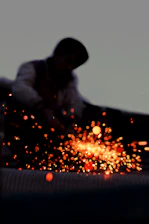a man working on a piece of metal