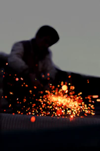 a man working on a piece of metal