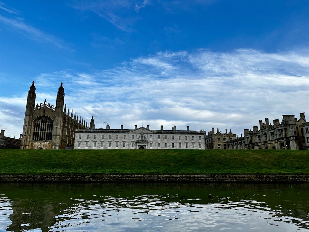 a large building sitting on top of a lush green field