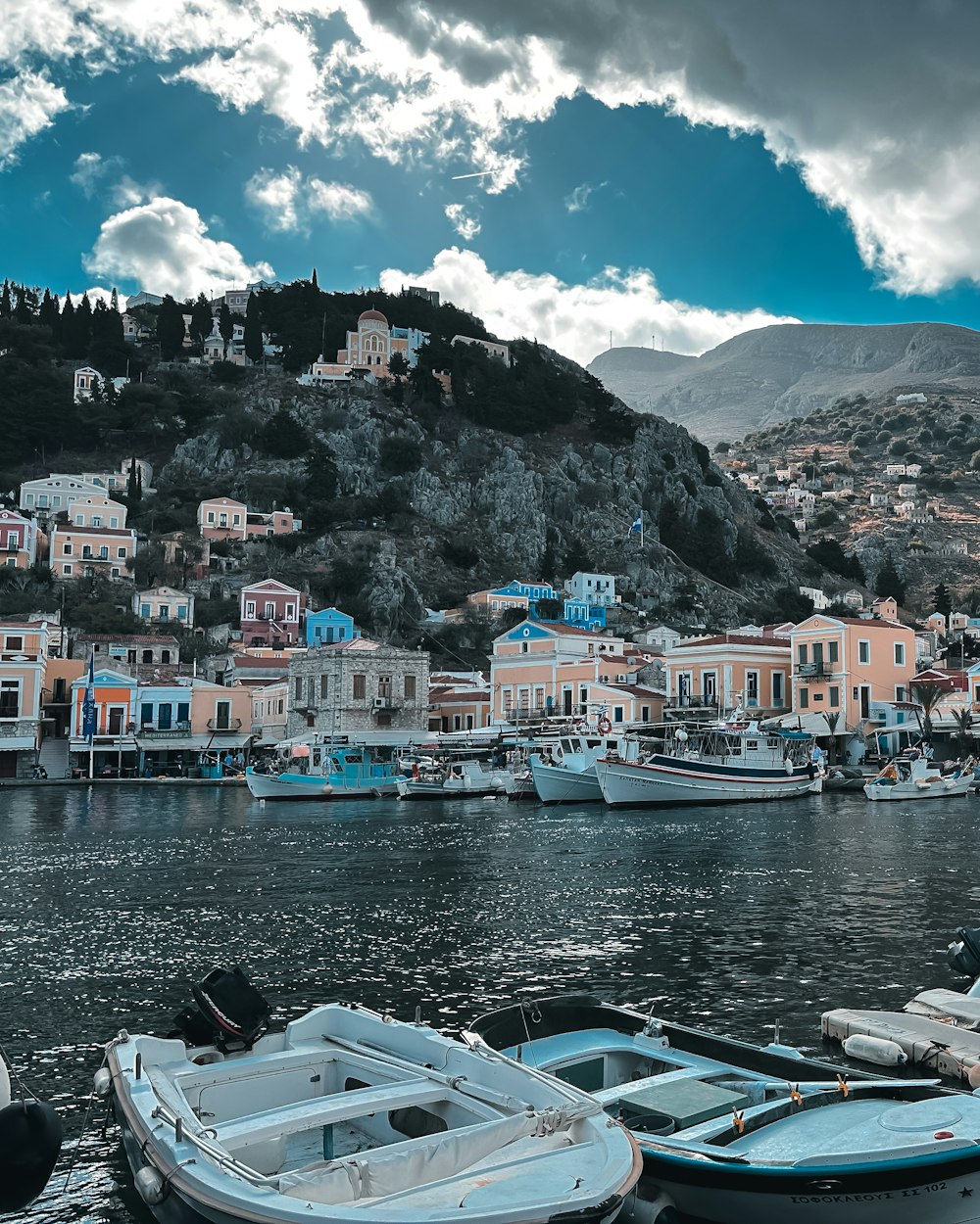 a group of boats sitting on top of a body of water