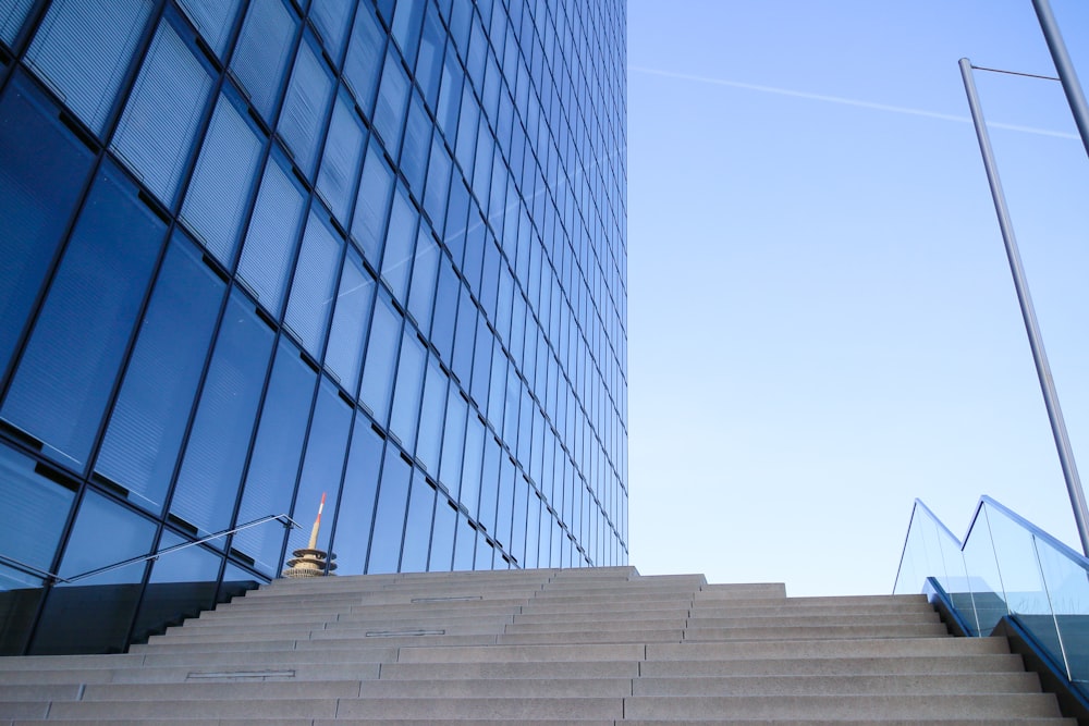 a set of stairs leading up to a tall building