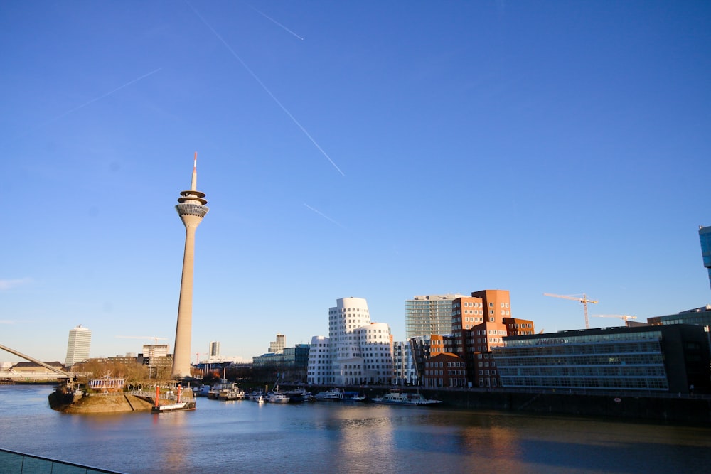 a view of a river with a tower in the background