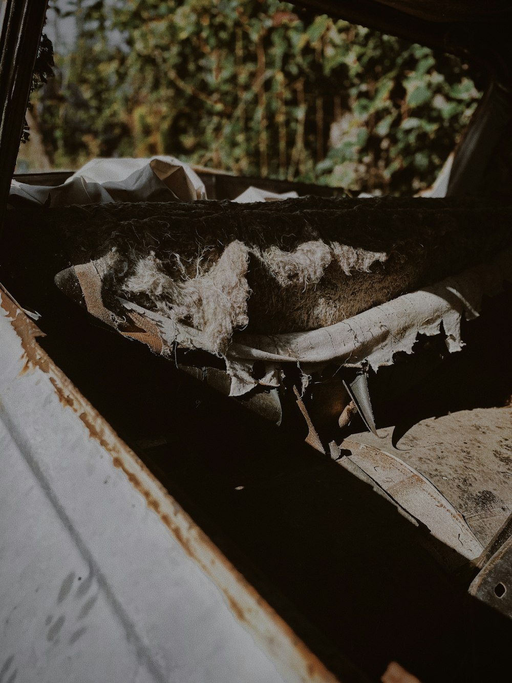 the interior of an old car with rust on it