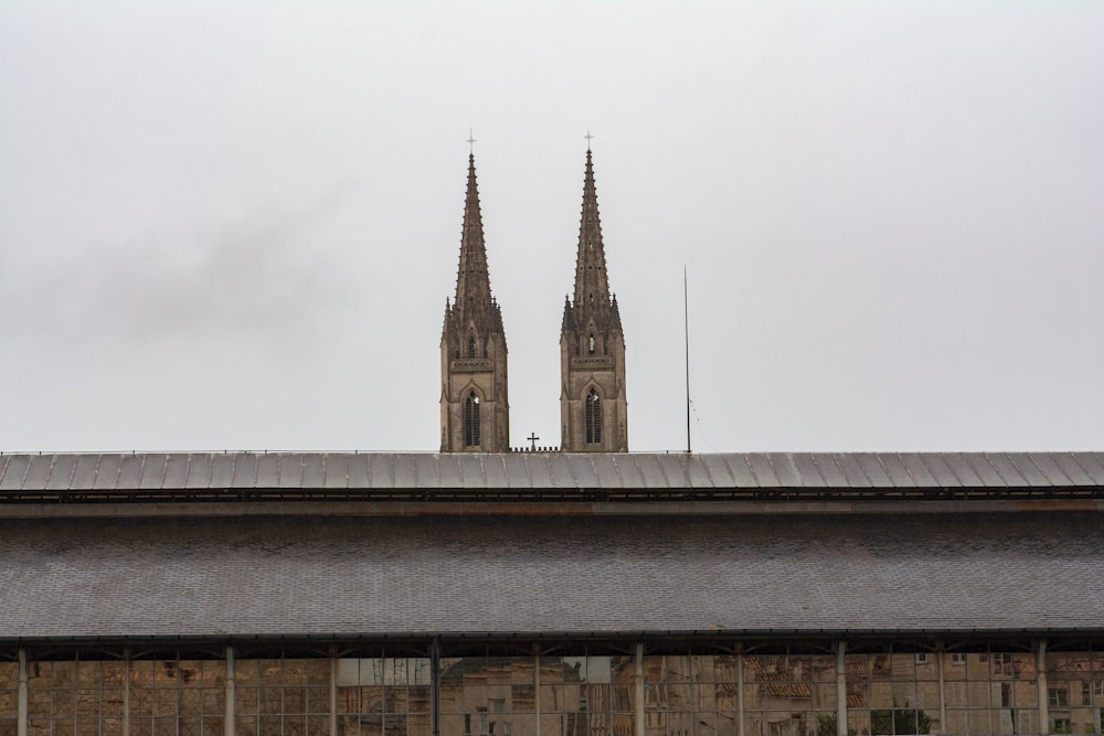 a view of a building with two spires on top of it