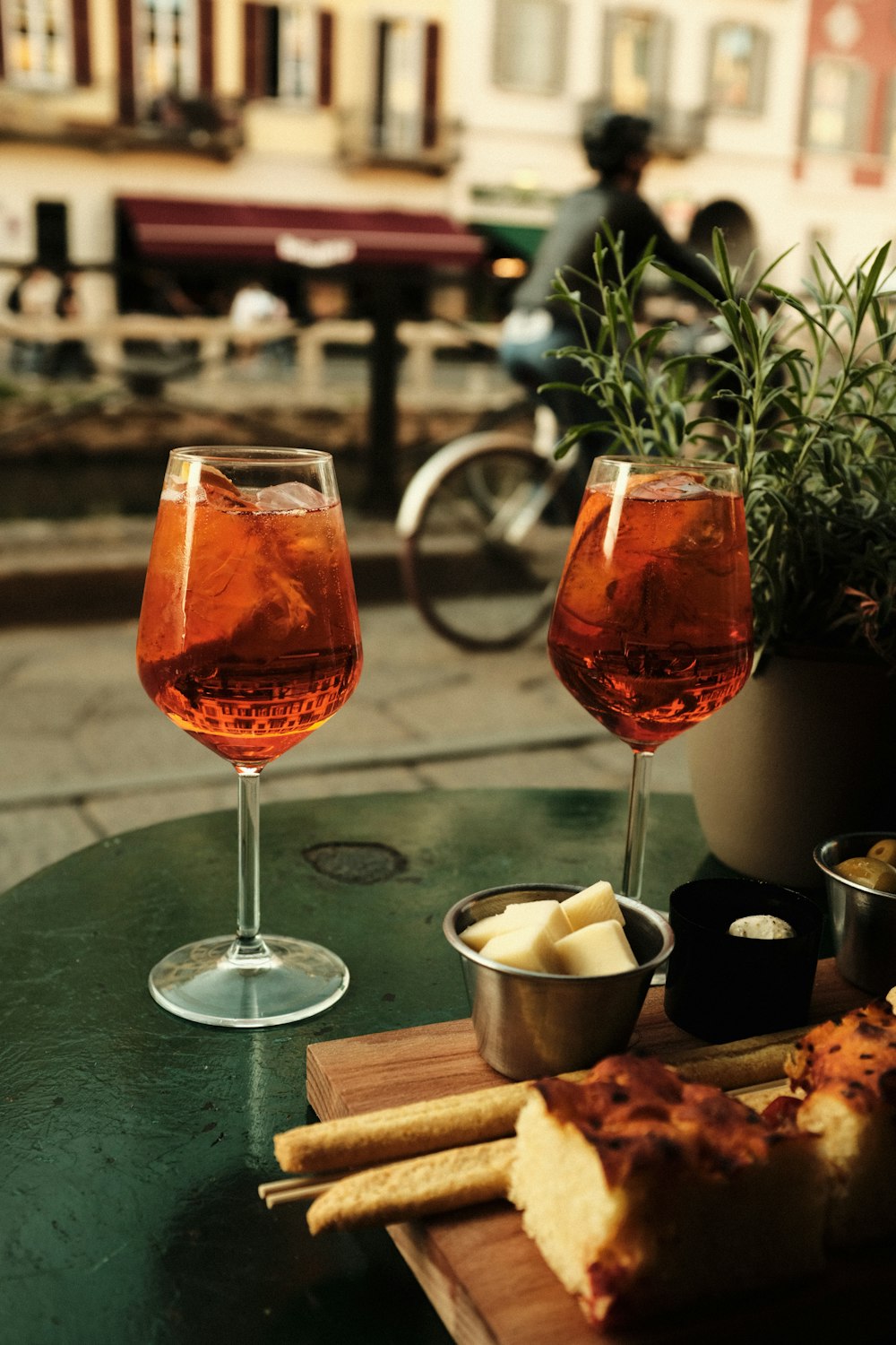 a couple of glasses of wine sitting on top of a table