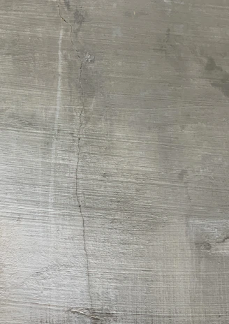 a close up of a metal plate with a clock on it
