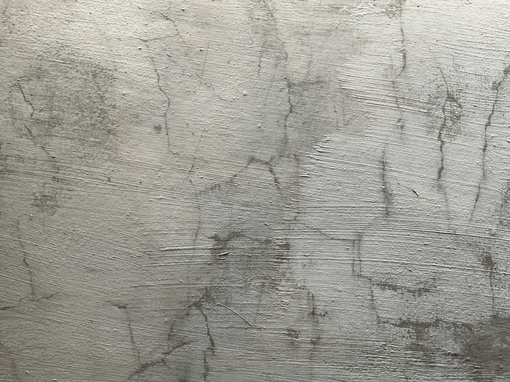 a close up of a wall with a lot of scratches on it