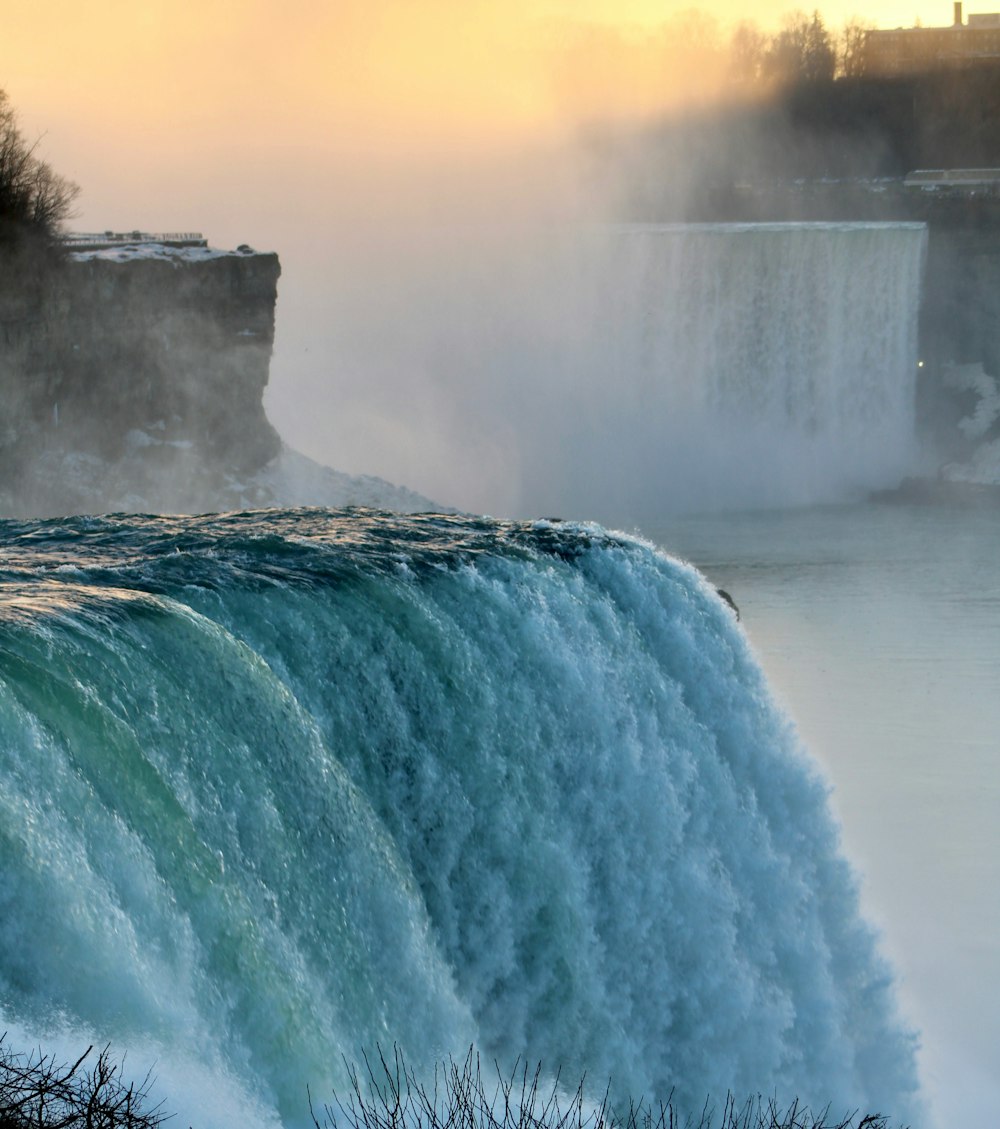 a large waterfall with water pouring out of it