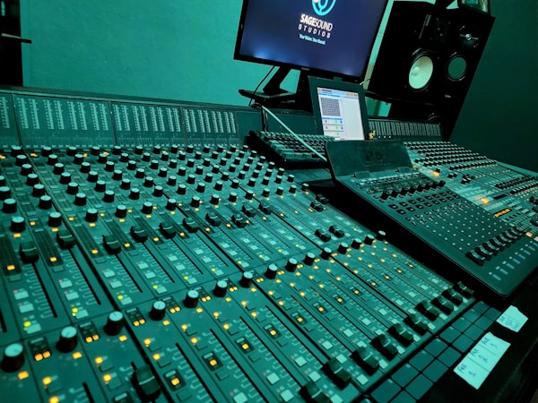 Mixing desk with monitor and studio speakers