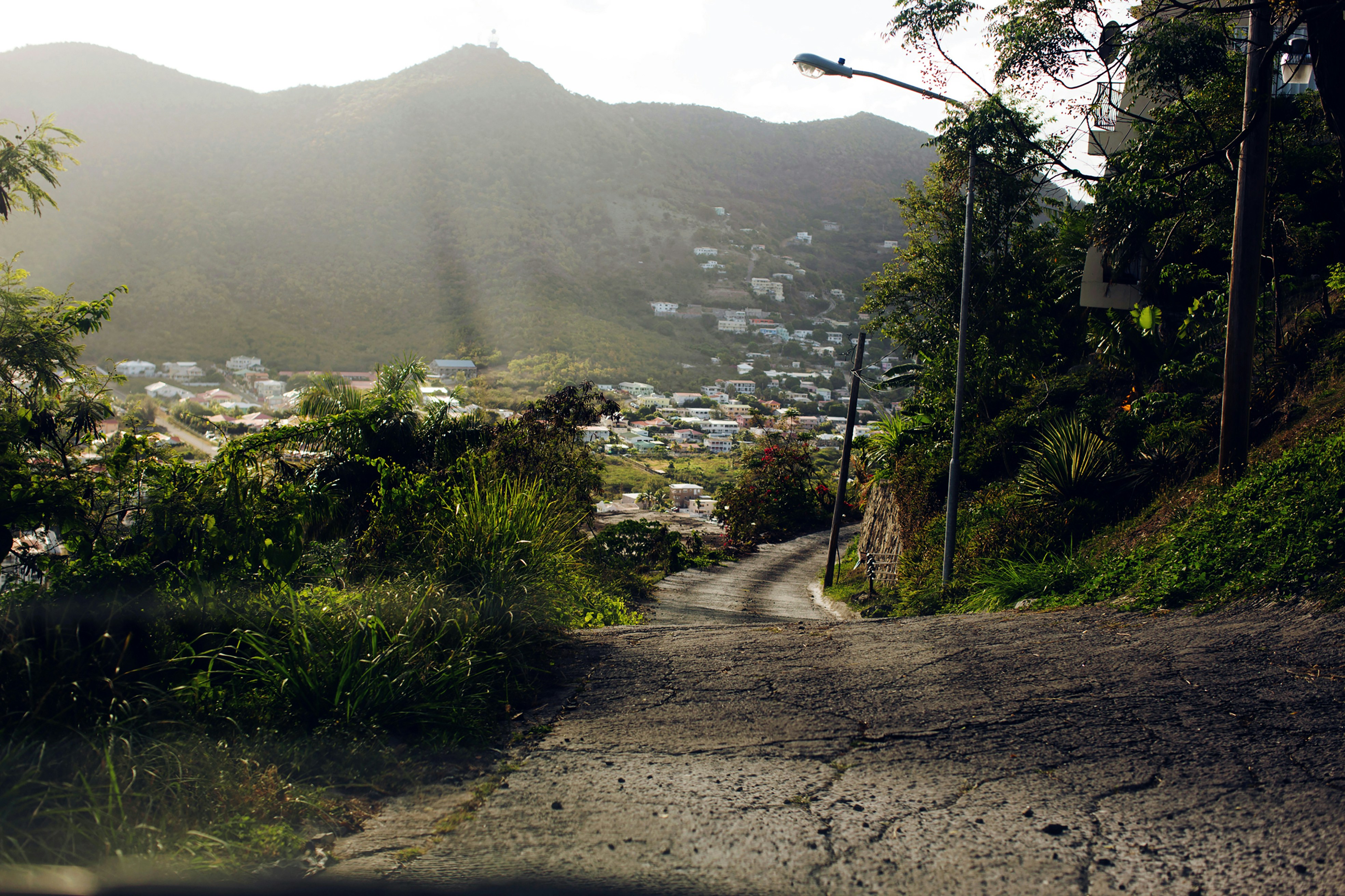 a view of a street with a mountain in the background