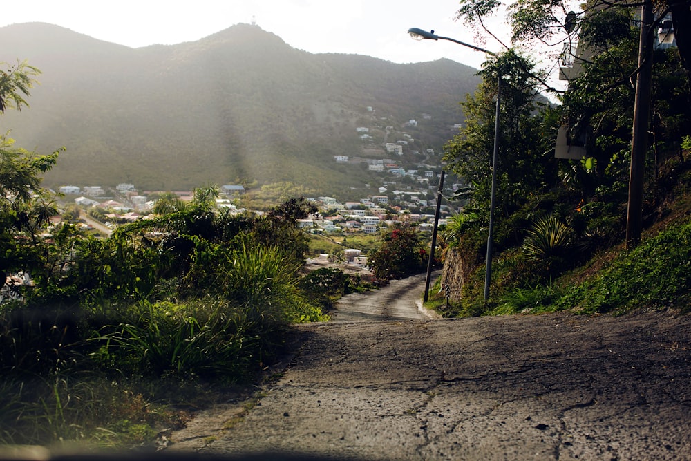 a view of a street with a mountain in the background