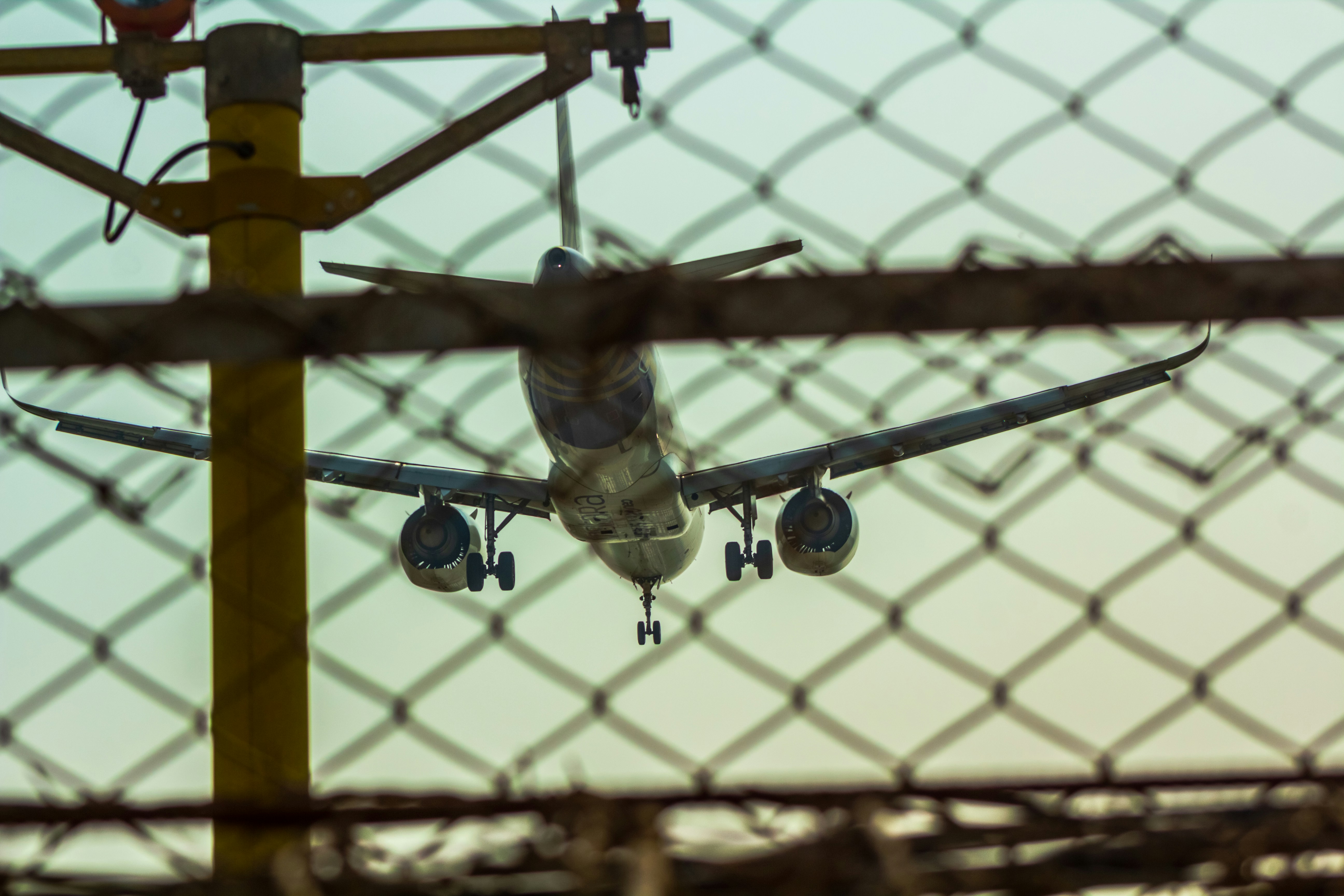 a large jetliner flying through a blue sky