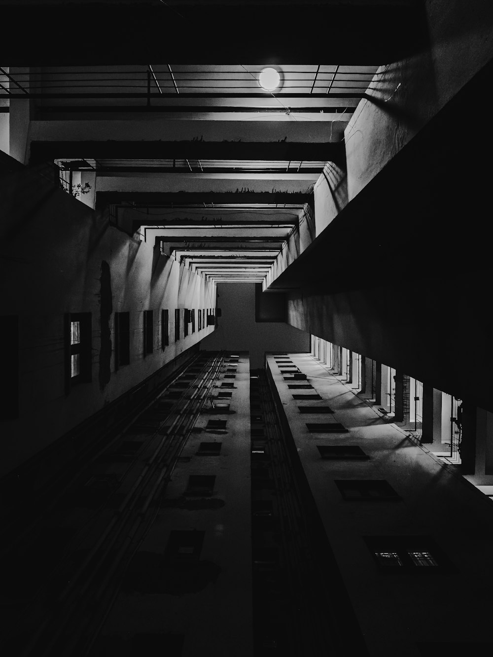 a black and white photo of a train station