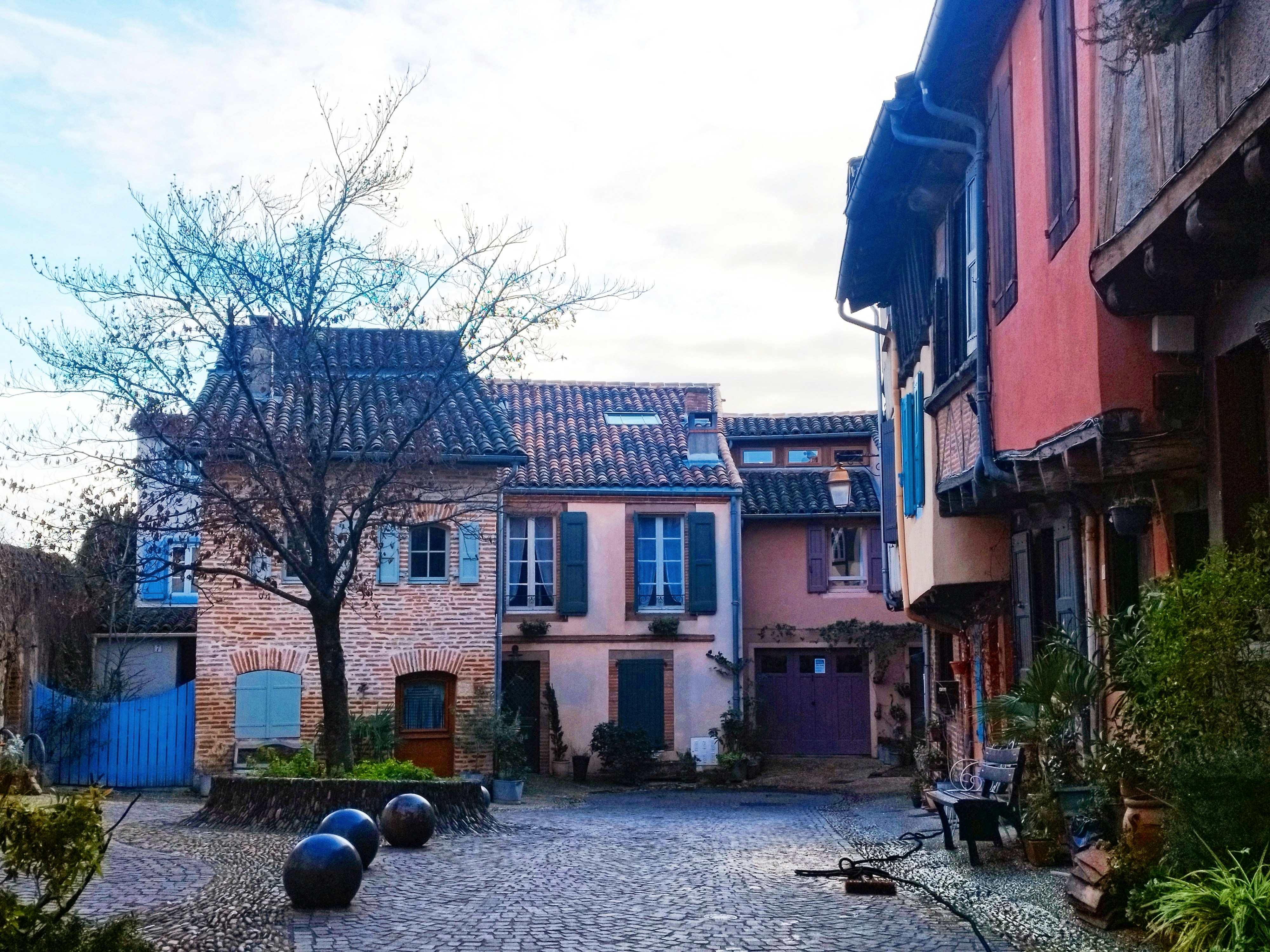 a cobblestone street in a european village