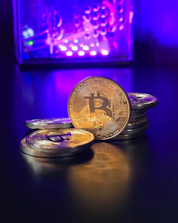a pile of bitcoins sitting on top of a table