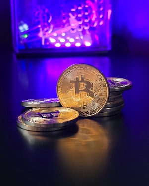 a pile of bitcoins sitting on top of a table