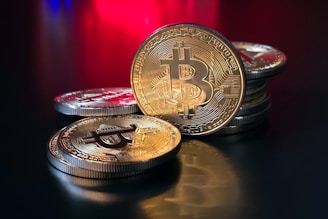 a pile of bitcoins sitting on top of a table
