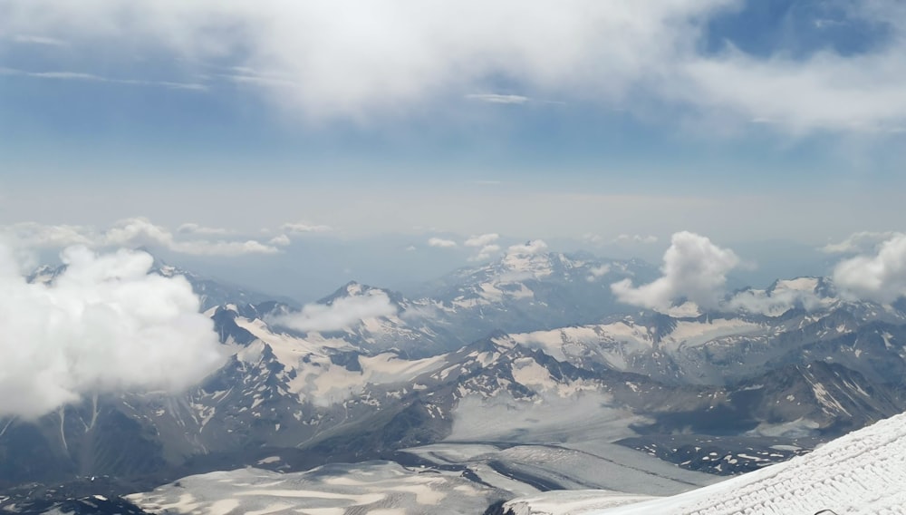 a person on a snowboard on top of a mountain