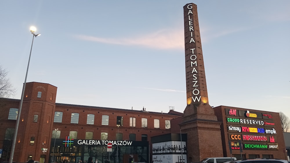 a tall brick building with a large sign on it's side