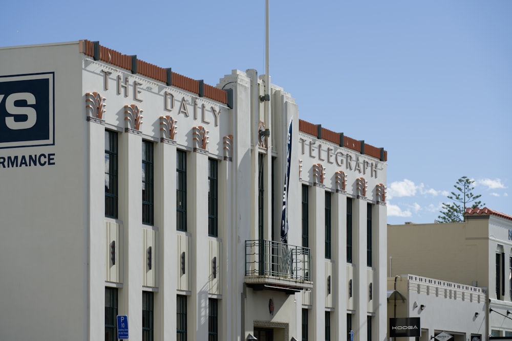 a tall building with a sign on the side of it