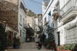 a person sitting on a set of steps in front of a building