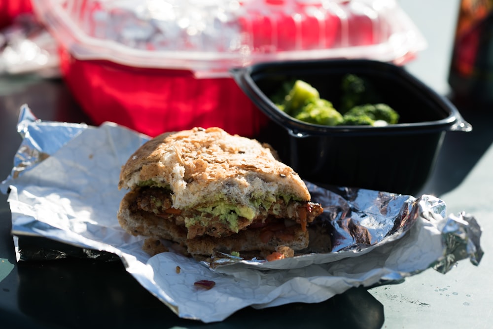 a sandwich sitting on top of a piece of tin foil