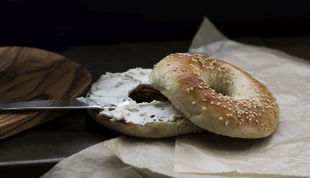 A bagel with a bite taken out of it
