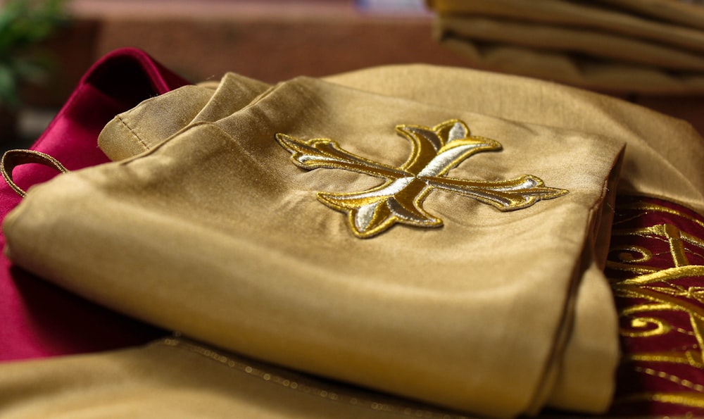 a close up of a cloth with a cross on it