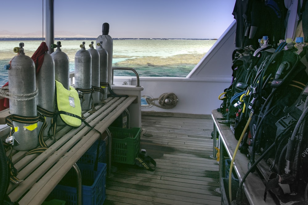 a row of scuba equipment sitting on top of a boat