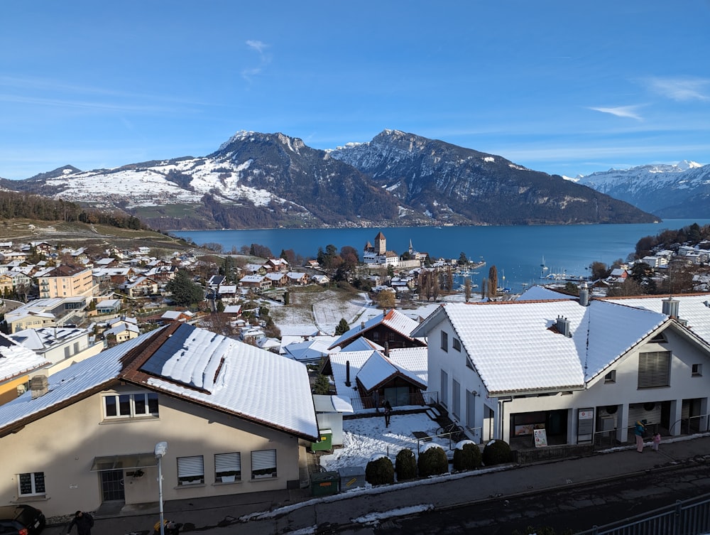 a view of a town with mountains in the background