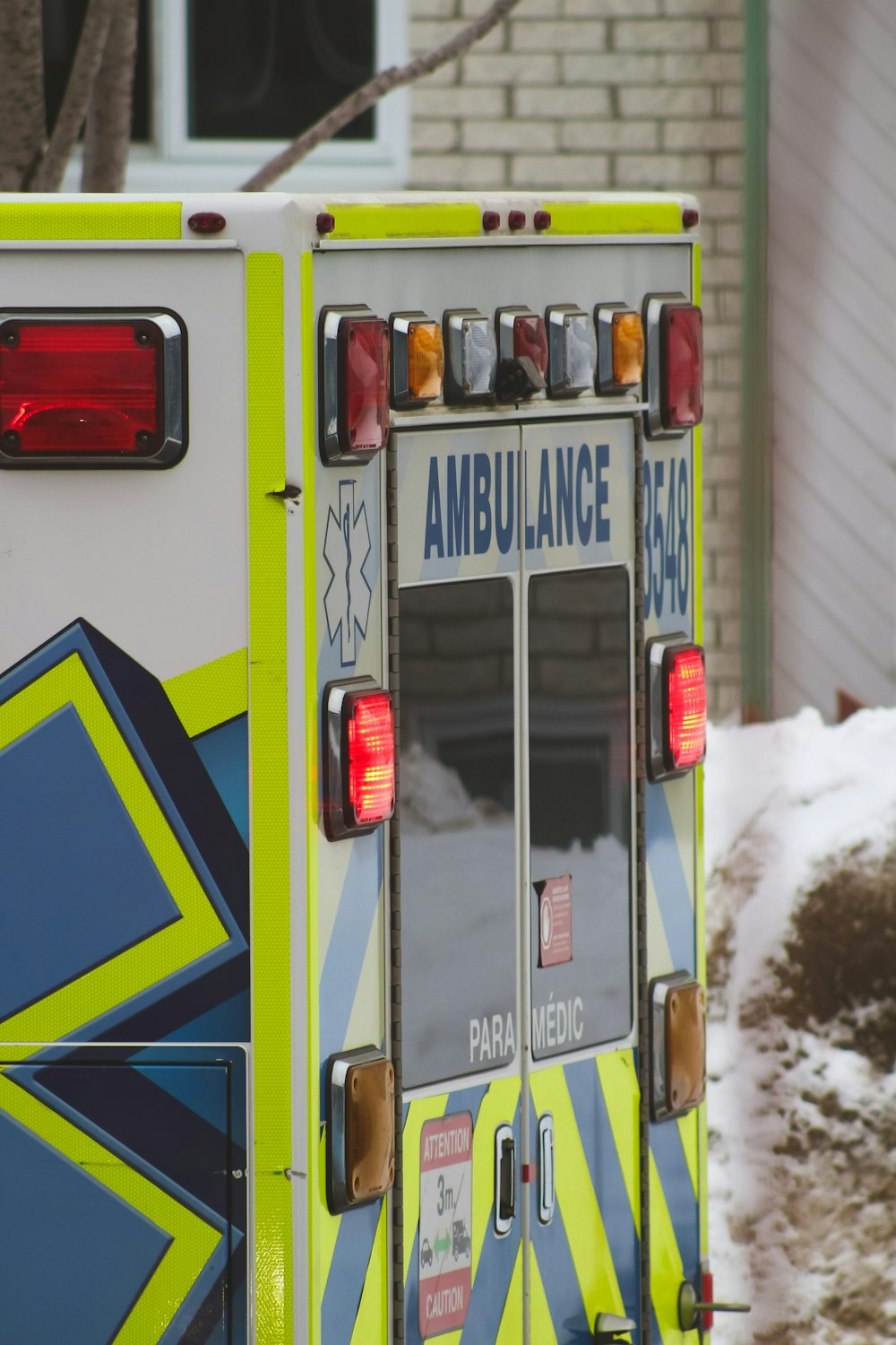 an ambulance is parked in front of a house