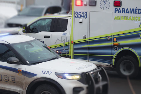 an ambulance is parked on the side of the road