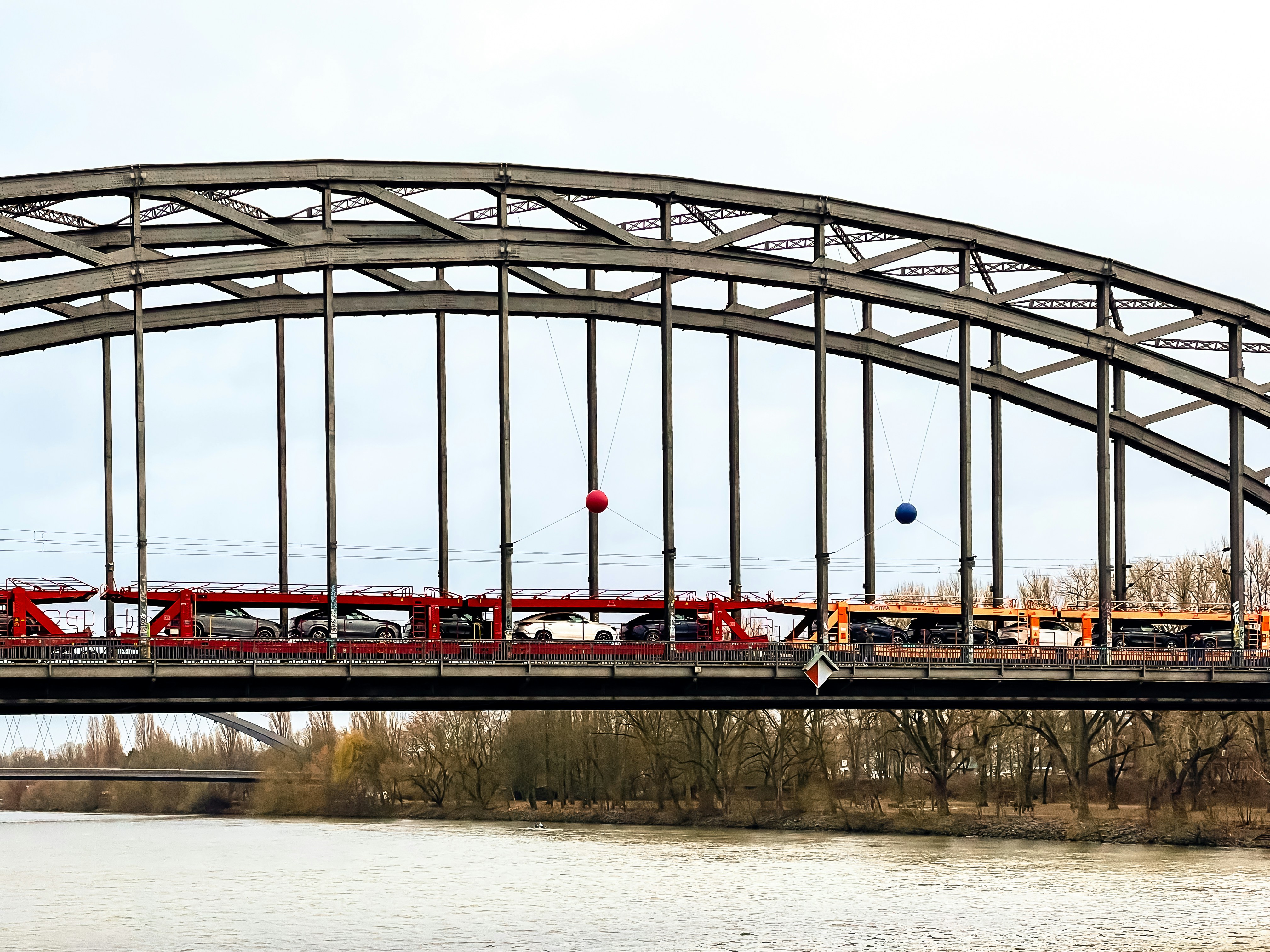 a train is crossing a bridge over a body of water