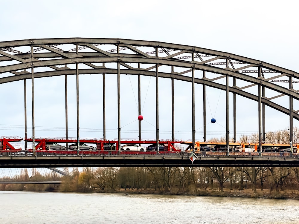 a train is crossing a bridge over a body of water