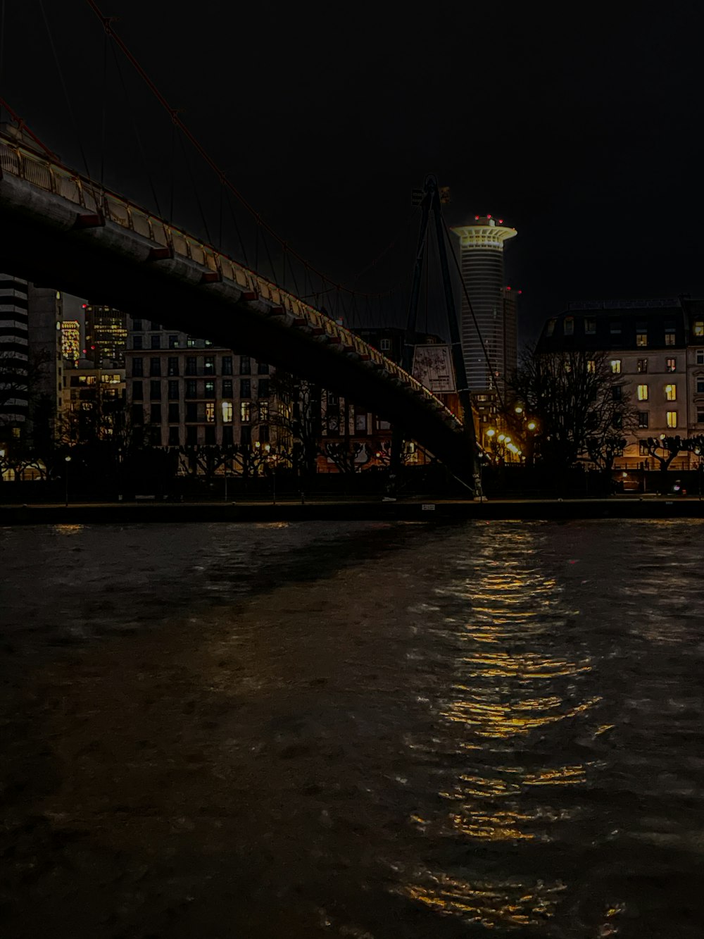 a bridge over a body of water at night