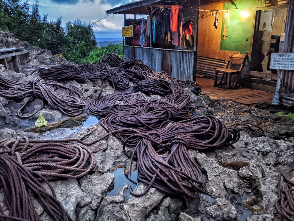 a pile of rope sitting on top of a rocky hillside