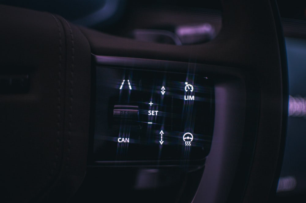 a close up of a car dashboard with buttons