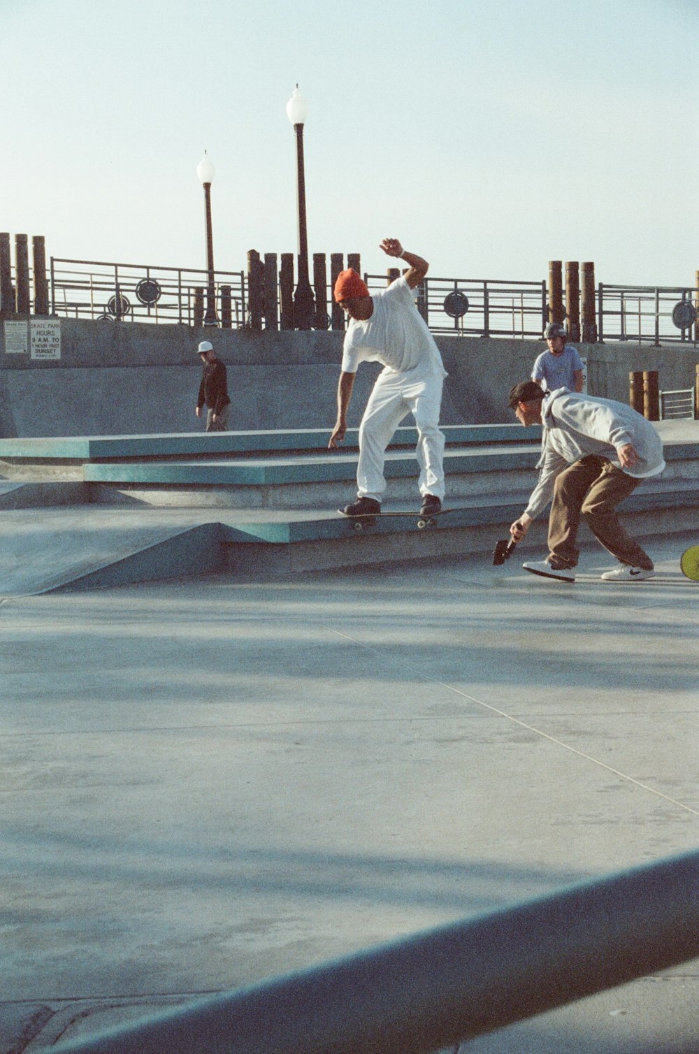 a group of young men riding skateboards on top of cement steps