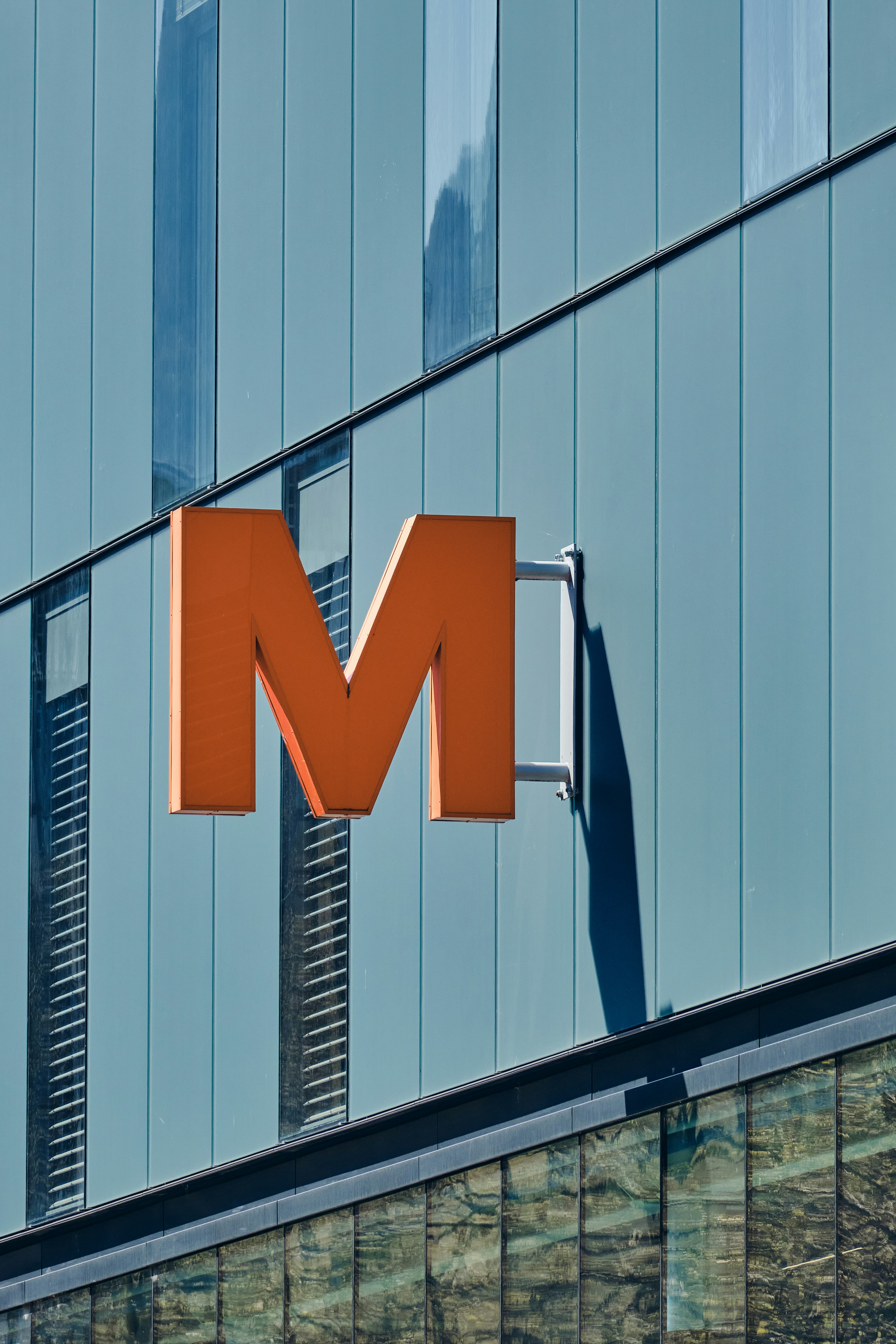 a building with a sign that says m on it
