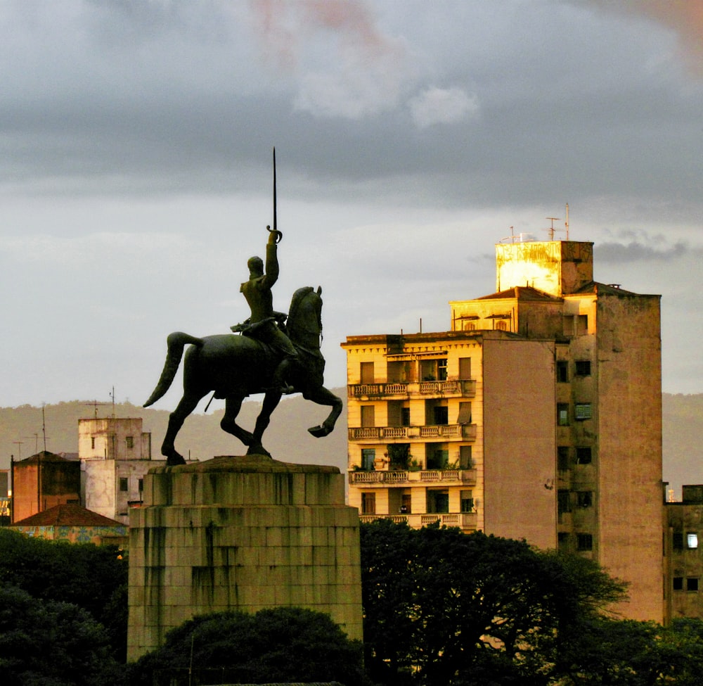 a statue of a man on a horse with a sword