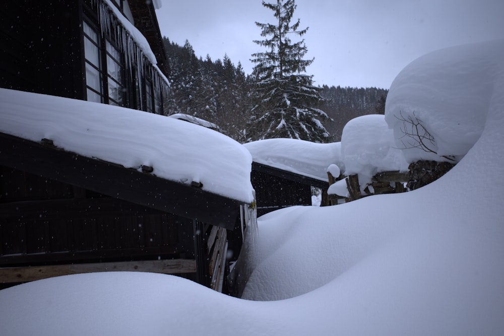 a pile of snow sitting next to a building