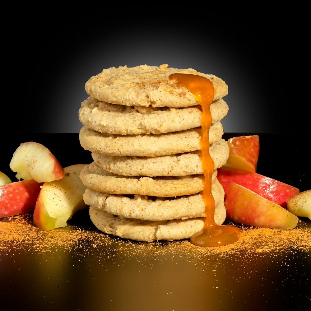 a stack of cookies with caramel sauce drizzled over them