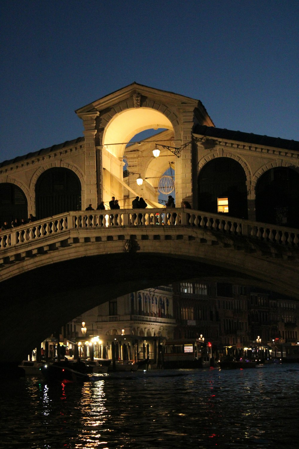 a bridge over a body of water at night