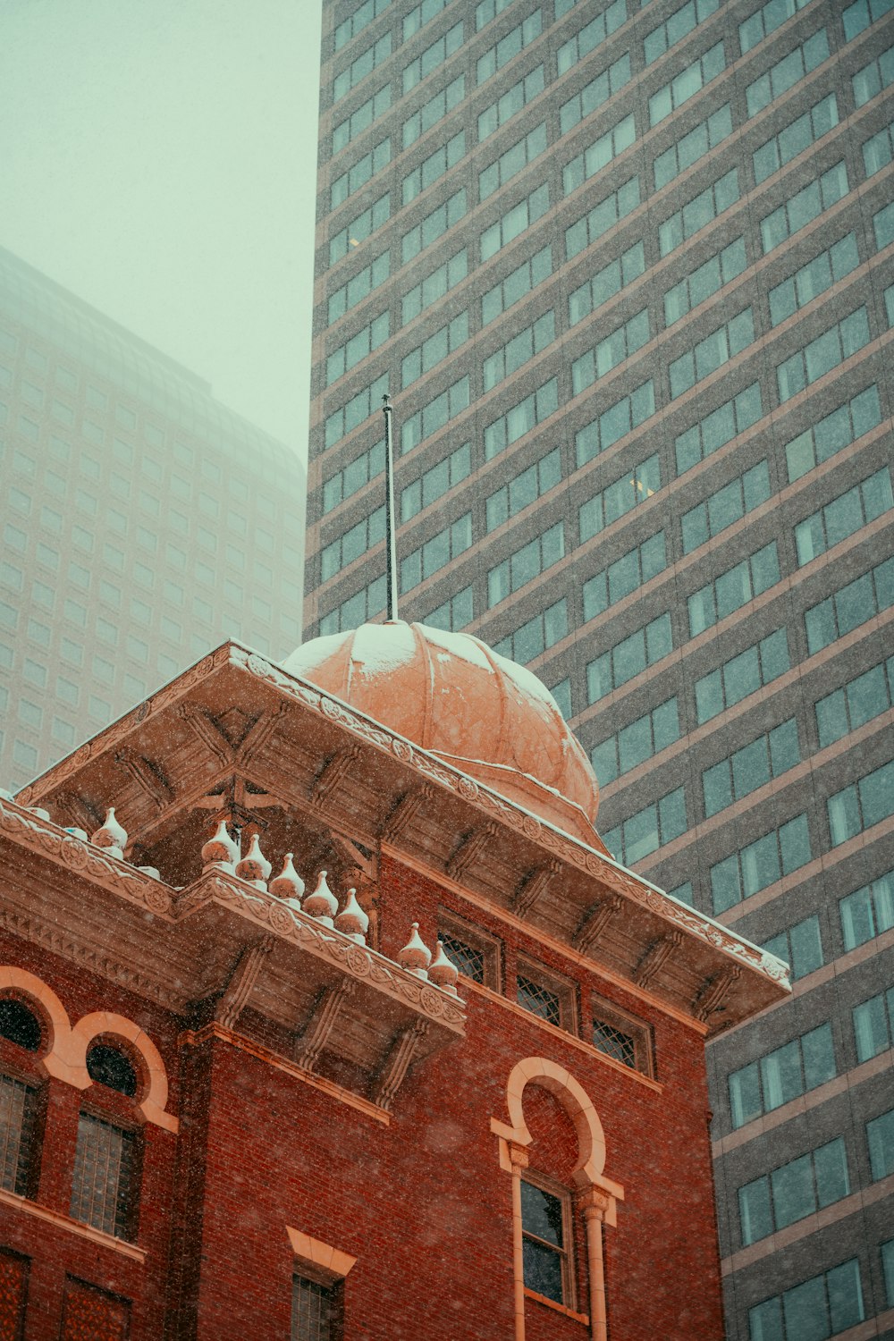 a red brick building with a dome on top