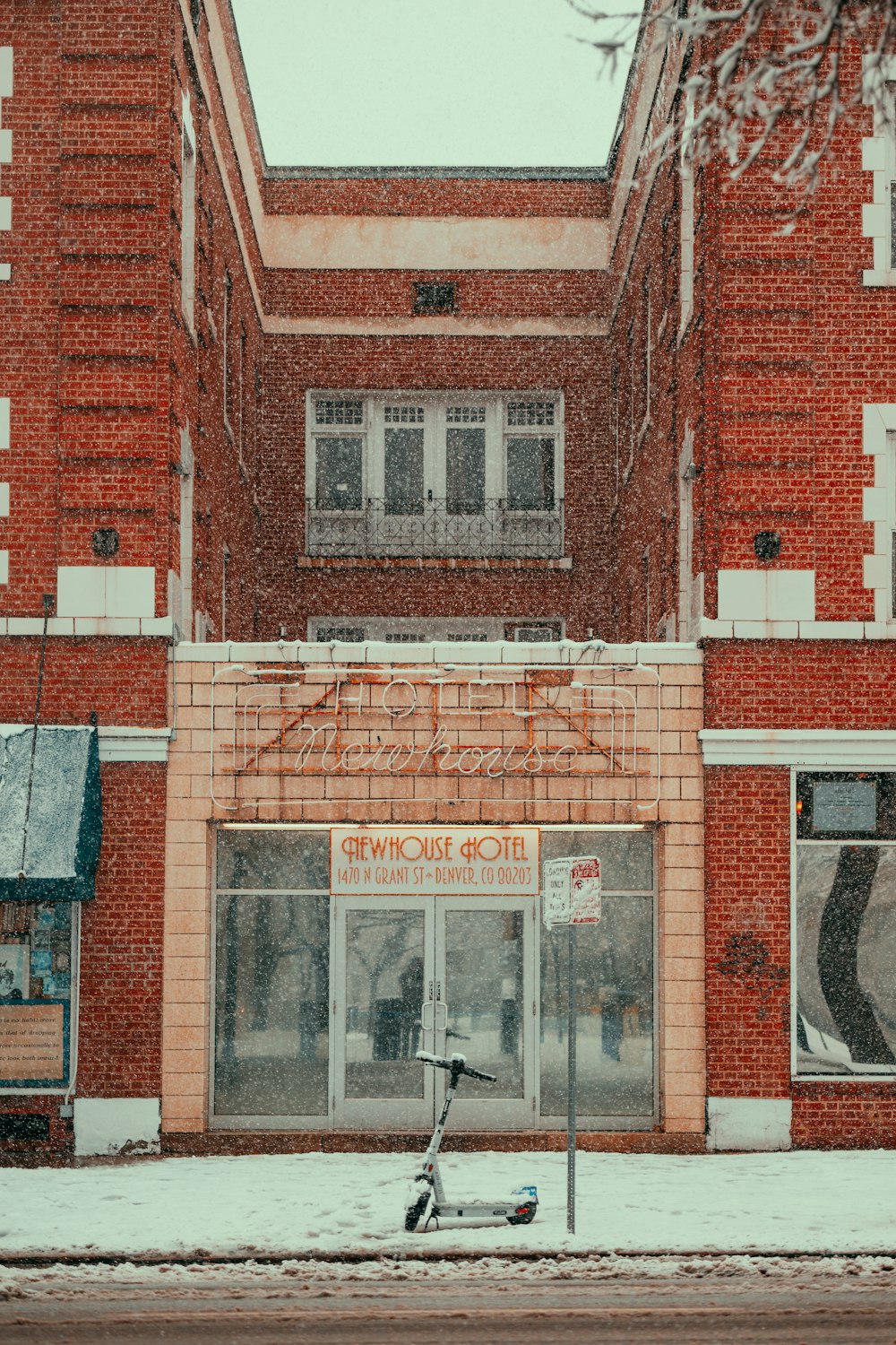 a bike parked in front of a red brick building