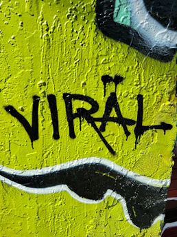 a close up of a wall with graffiti on it